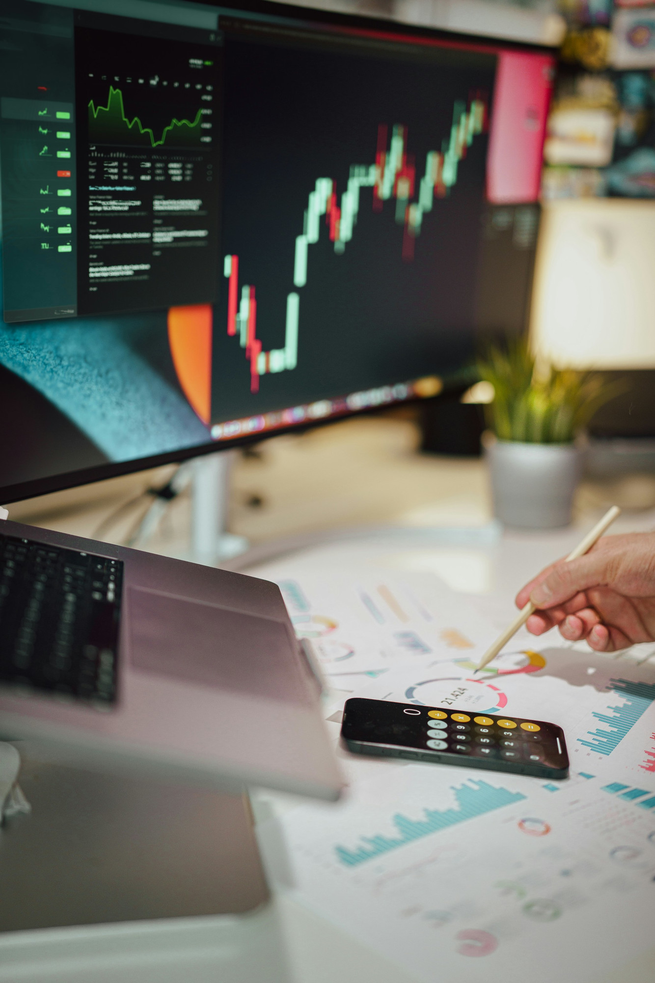 A trader reviewing market analysis on multiple screens